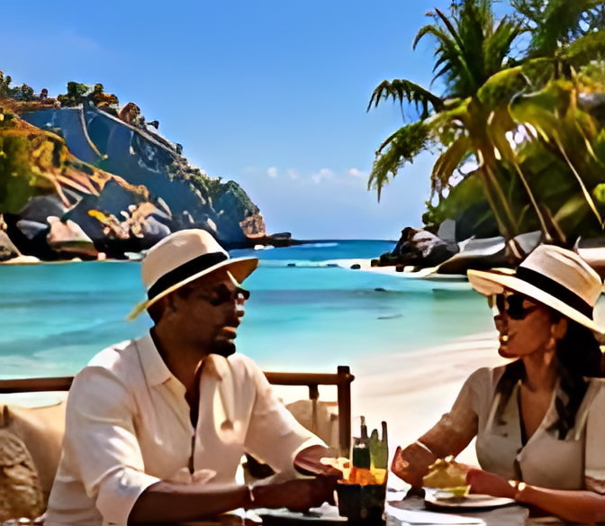 Two guests dining at a table set beside the sea