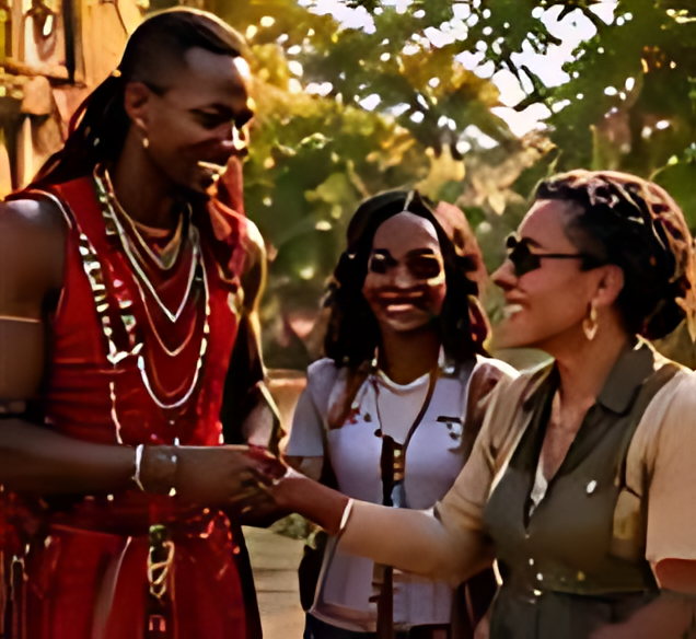 Maasai hosts in red robes welcoming arriving guests