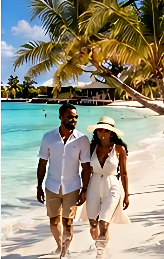 Two travellers walking a palm-lined beach on Zanzibar